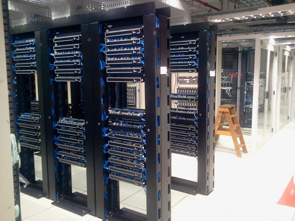 Data center server room representing web hosting market growth